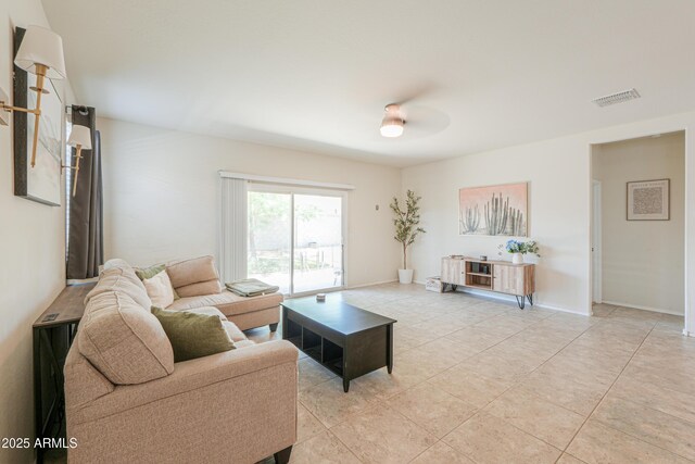 36467 W Pampoloma Ave, Maricopa, AZ 85138 - living area with light tile patterned flooring, a ceiling fan, and baseboards
