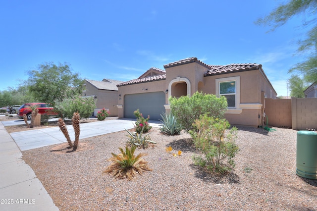 36467 W Pampoloma Ave, Maricopa, AZ 85138 - mediterranean / spanish house with driveway, stucco siding, a tiled roof, fence, and an attached garage