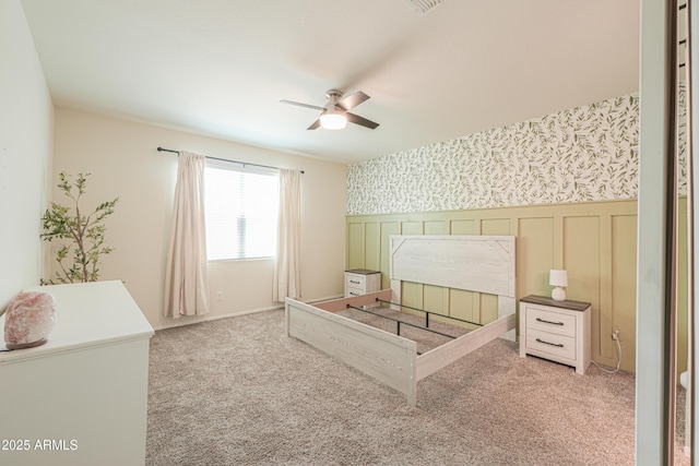 36467 W Pampoloma Ave, Maricopa, AZ 85138 - unfurnished bedroom with wallpapered walls, a wainscoted wall, carpet, and ceiling fan