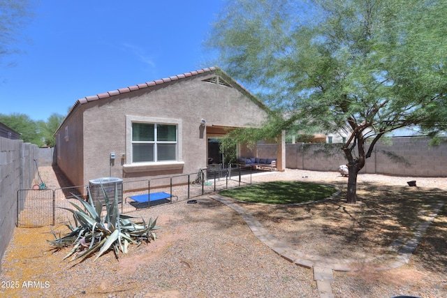 36467 W Pampoloma Ave, Maricopa, AZ 85138 - rear view of property with stucco siding, a fenced backyard, central air condition unit, and a tile roof