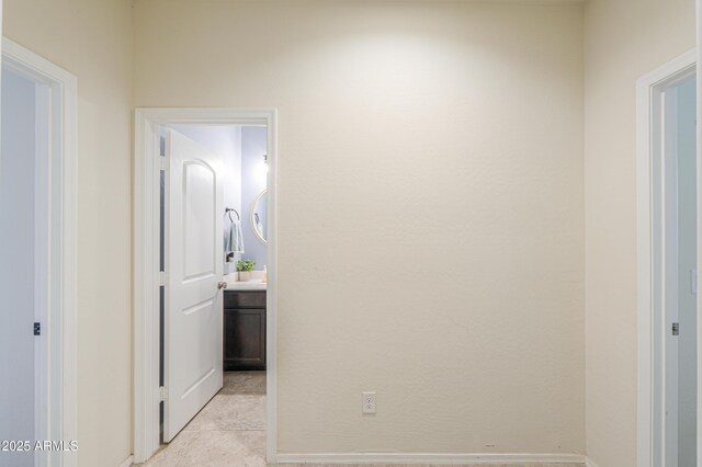 36467 W Pampoloma Ave, Maricopa, AZ 85138 - hallway with light tile patterned flooring and baseboards