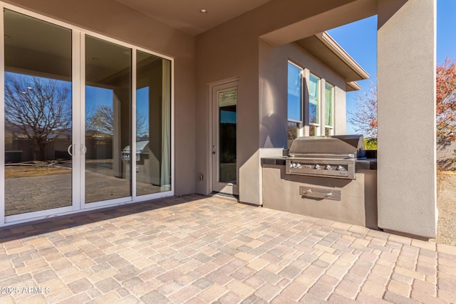 view of patio / terrace with area for grilling and exterior kitchen