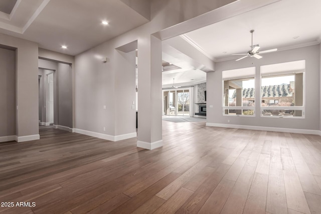 unfurnished living room featuring crown molding, ceiling fan, and hardwood / wood-style floors