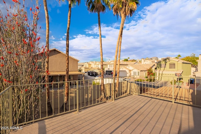 wooden terrace featuring a residential view