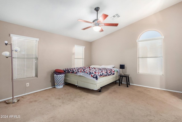 carpeted bedroom with ceiling fan and lofted ceiling