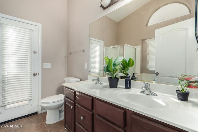 bathroom featuring tile patterned floors, plenty of natural light, vanity, and an enclosed shower