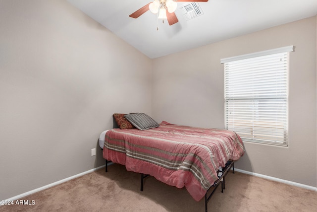 bedroom with ceiling fan, light carpet, and lofted ceiling