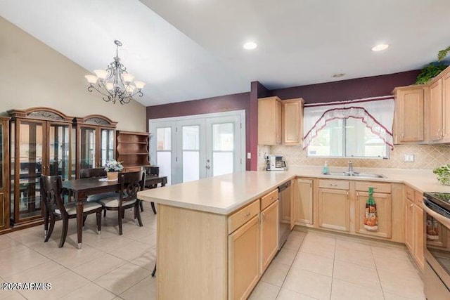 kitchen featuring tasteful backsplash, sink, light brown cabinetry, and french doors