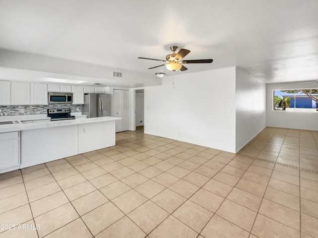 920 E Garnet Ave, Mesa, AZ 85204 - unfurnished living room with light tile patterned floors, ceiling fan, and a sink