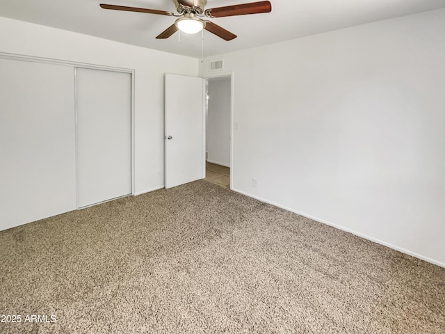 920 E Garnet Ave, Mesa, AZ 85204 - unfurnished bedroom featuring a closet, carpet, and ceiling fan