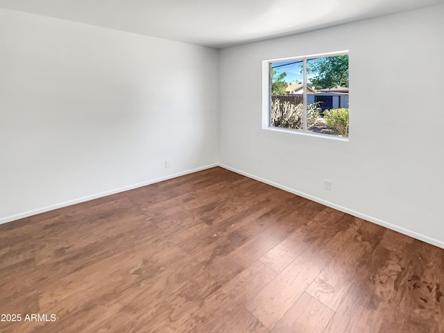 920 E Garnet Ave, Mesa, AZ 85204 - empty room featuring baseboards and wood finished floors