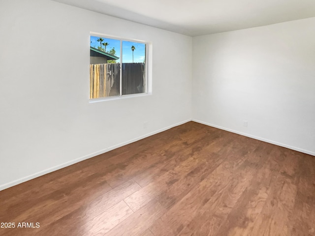920 E Garnet Ave, Mesa, AZ 85204 - empty room featuring wood finished floors and baseboards