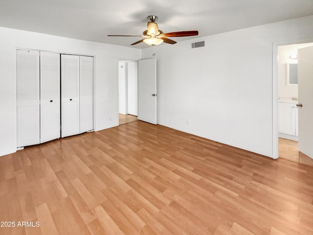 920 E Garnet Ave, Mesa, AZ 85204 - unfurnished bedroom with light wood finished floors, a closet, and ceiling fan