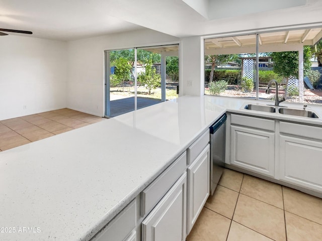 920 E Garnet Ave, Mesa, AZ 85204 - kitchen with a sink, light tile patterned flooring, light countertops, and stainless steel dishwasher
