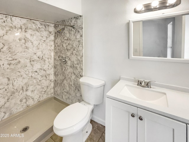 920 E Garnet Ave, Mesa, AZ 85204 - bathroom featuring vanity, a tile shower, and toilet