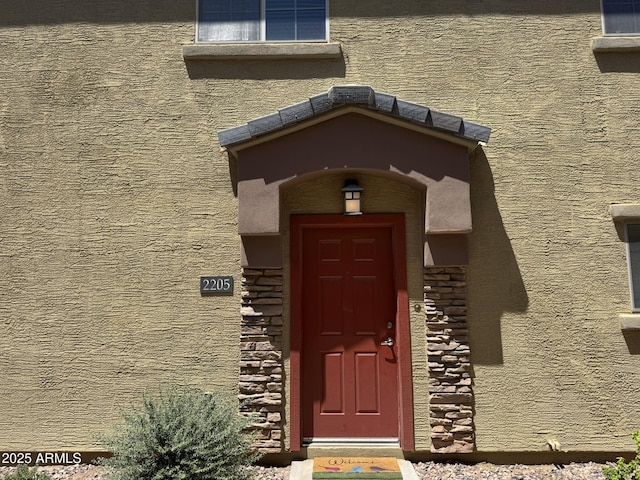 1350 S Greenfield Rd Unit 2205, Mesa, AZ 85206 - doorway to property with stone siding