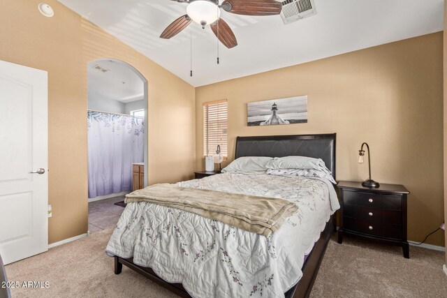 1350 S Greenfield Rd Unit 2205, Mesa, AZ 85206 - carpeted bedroom featuring arched walkways, baseboards, and a ceiling fan