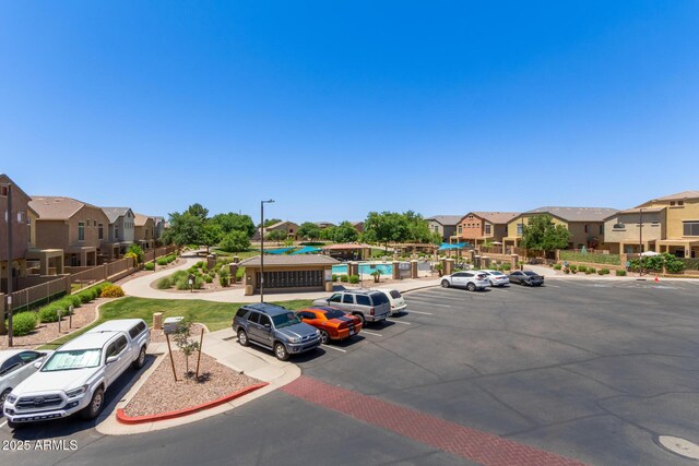 1350 S Greenfield Rd Unit 2205, Mesa, AZ 85206 - uncovered parking lot with a residential view