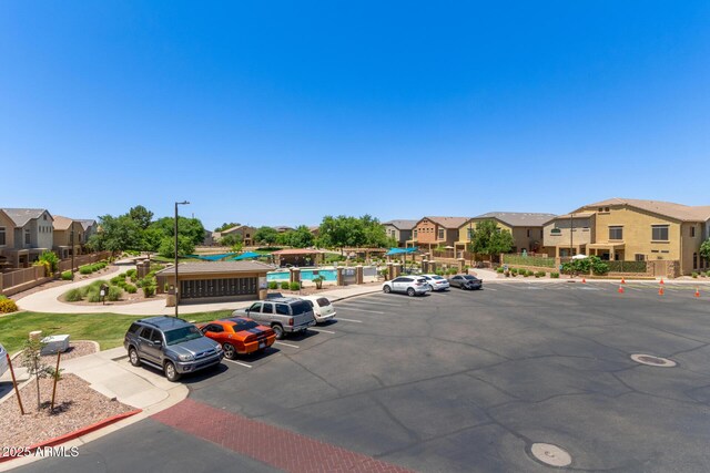 1350 S Greenfield Rd Unit 2205, Mesa, AZ 85206 - uncovered parking lot with a residential view