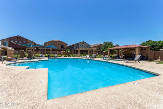 1350 S Greenfield Rd Unit 2205, Mesa, AZ 85206 - community pool featuring a gazebo, fence, a patio, and a residential view