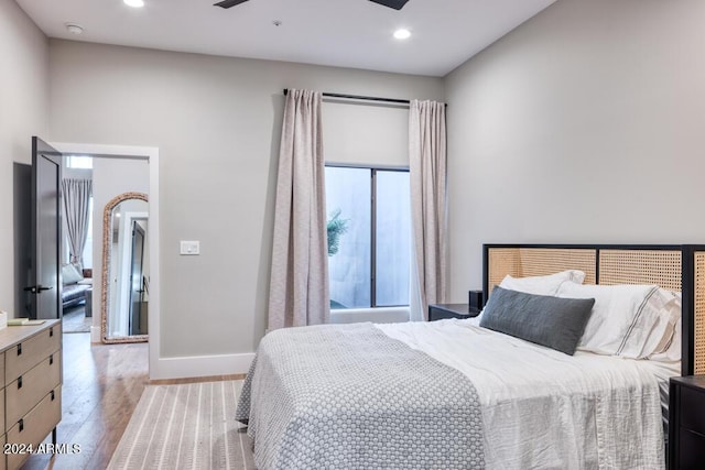 bedroom with light wood-type flooring and ceiling fan