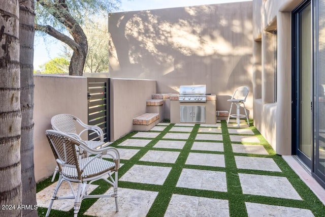 view of patio with area for grilling and grilling area