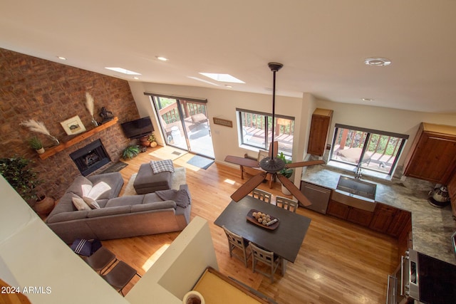5120 N Juniper Loop, Pine, AZ 85544 - living room with light wood-style floors, a brick fireplace, and recessed lighting