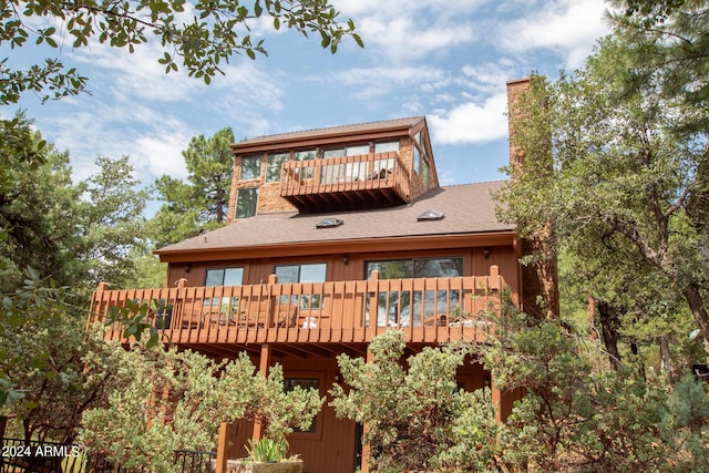 5120 N Juniper Loop, Pine, AZ 85544 - rear view of house with a balcony, a chimney, and a shingled roof