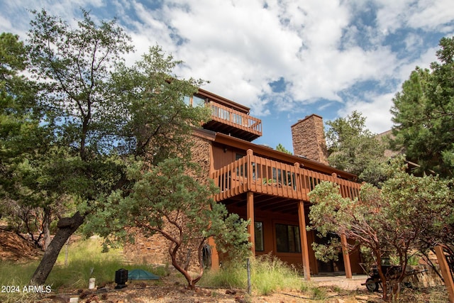 5120 N Juniper Loop, Pine, AZ 85544 - back of house with a wooden deck, a chimney, and a balcony