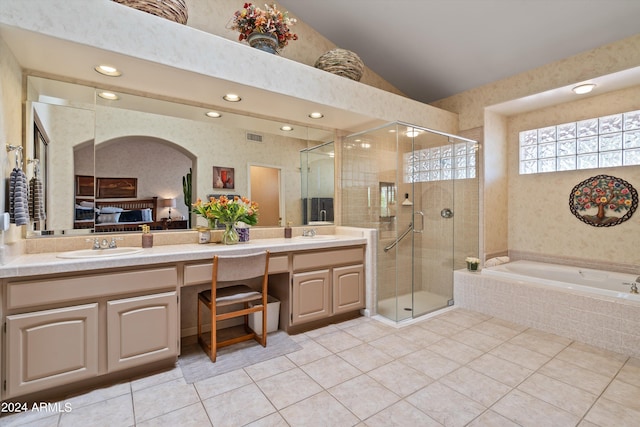 bathroom featuring vanity, plus walk in shower, tile patterned floors, and vaulted ceiling