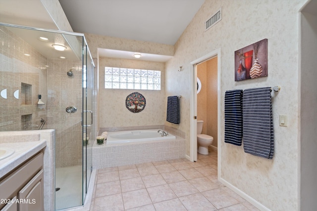 full bathroom with toilet, tile patterned flooring, independent shower and bath, vaulted ceiling, and vanity