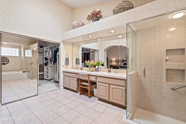 bathroom with vanity, tile patterned floors, and a shower with shower door