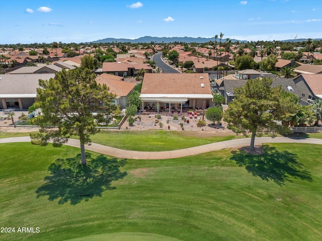 birds eye view of property with a mountain view