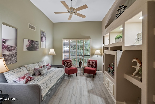 living area with light hardwood / wood-style flooring and ceiling fan