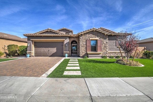 view of front of home featuring a garage and a front lawn