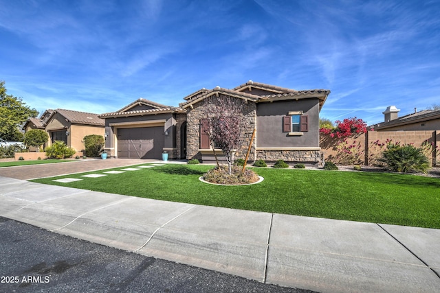 mediterranean / spanish-style house featuring a garage and a front lawn