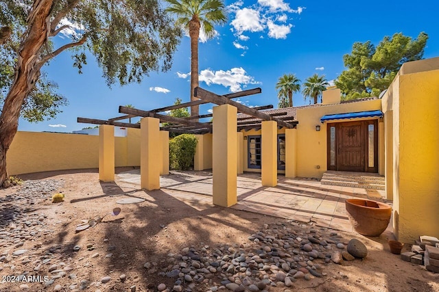 back of house with a patio and a pergola