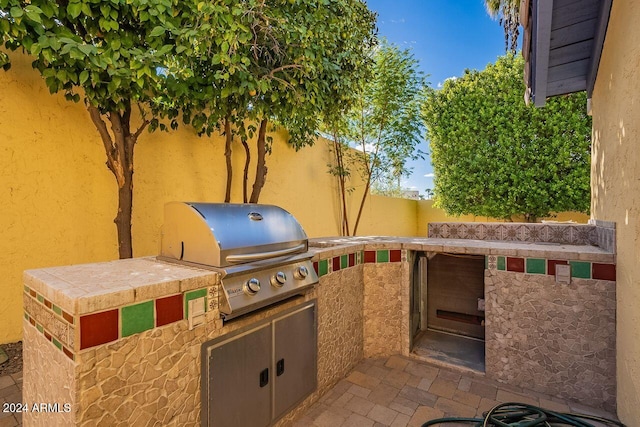 view of patio featuring grilling area and an outdoor kitchen