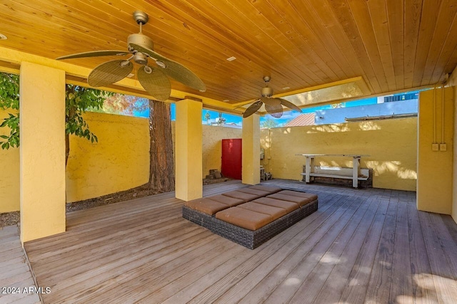 wooden deck featuring ceiling fan