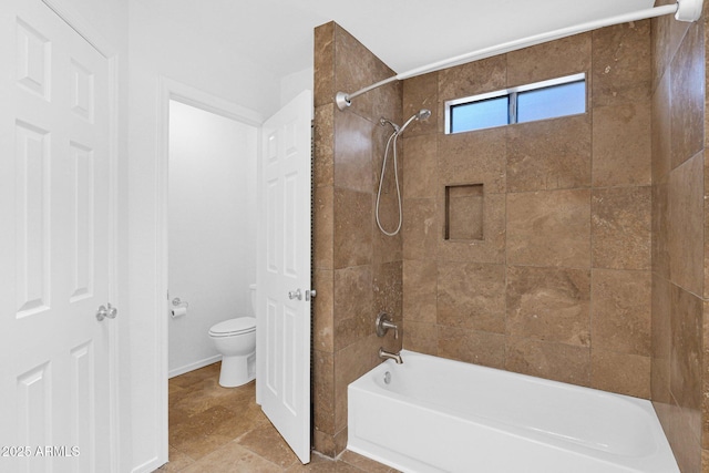 bathroom with toilet and shower / washtub combination