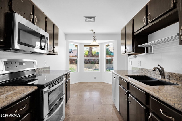 kitchen with visible vents, appliances with stainless steel finishes, open shelves, a sink, and light stone counters