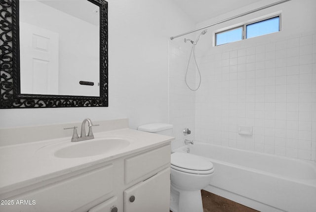 bathroom featuring vanity, toilet, and shower / washtub combination