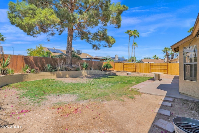 view of yard featuring a patio and a fenced backyard