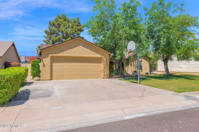 view of front of house featuring concrete driveway, a garage, a front yard, and stucco siding