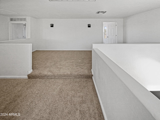 hallway with carpet floors