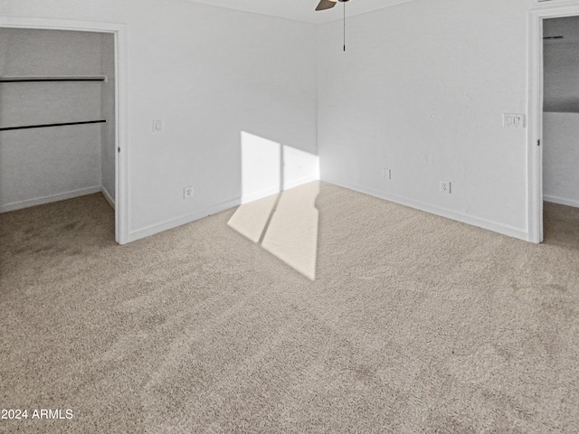 unfurnished bedroom featuring carpet and ceiling fan