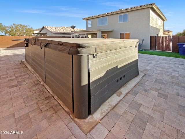 exterior space with a hot tub