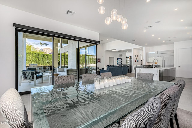 dining space featuring a notable chandelier