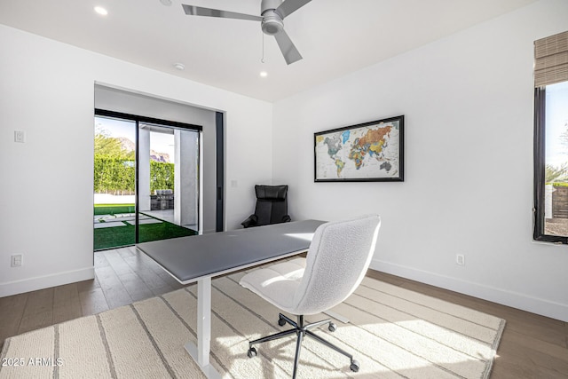 office area with hardwood / wood-style flooring and ceiling fan