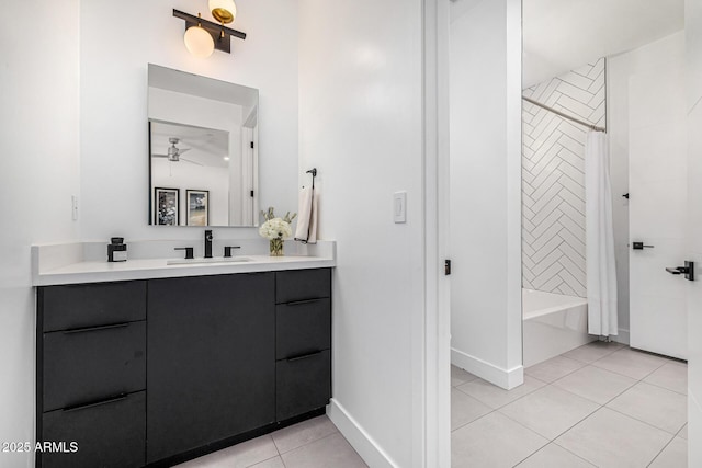 bathroom with tile patterned flooring, shower / bath combo, vanity, and ceiling fan